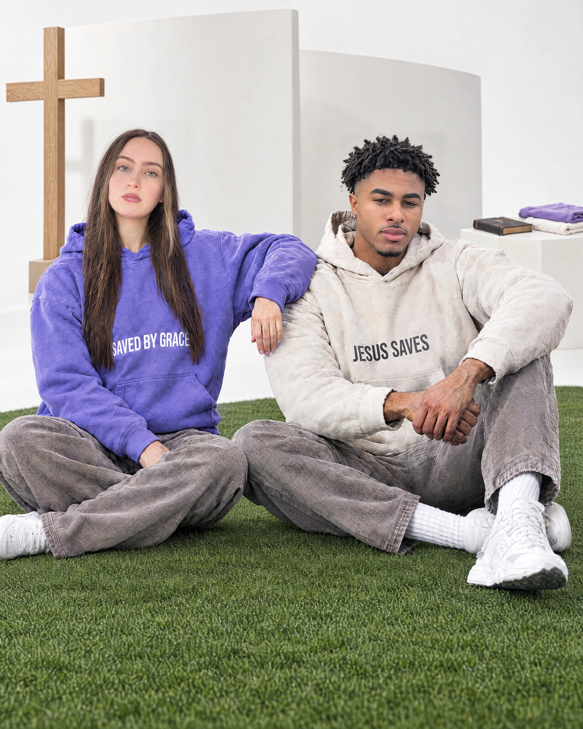 Nicole and Isaiah wearing JSCA hoodies together in the studio